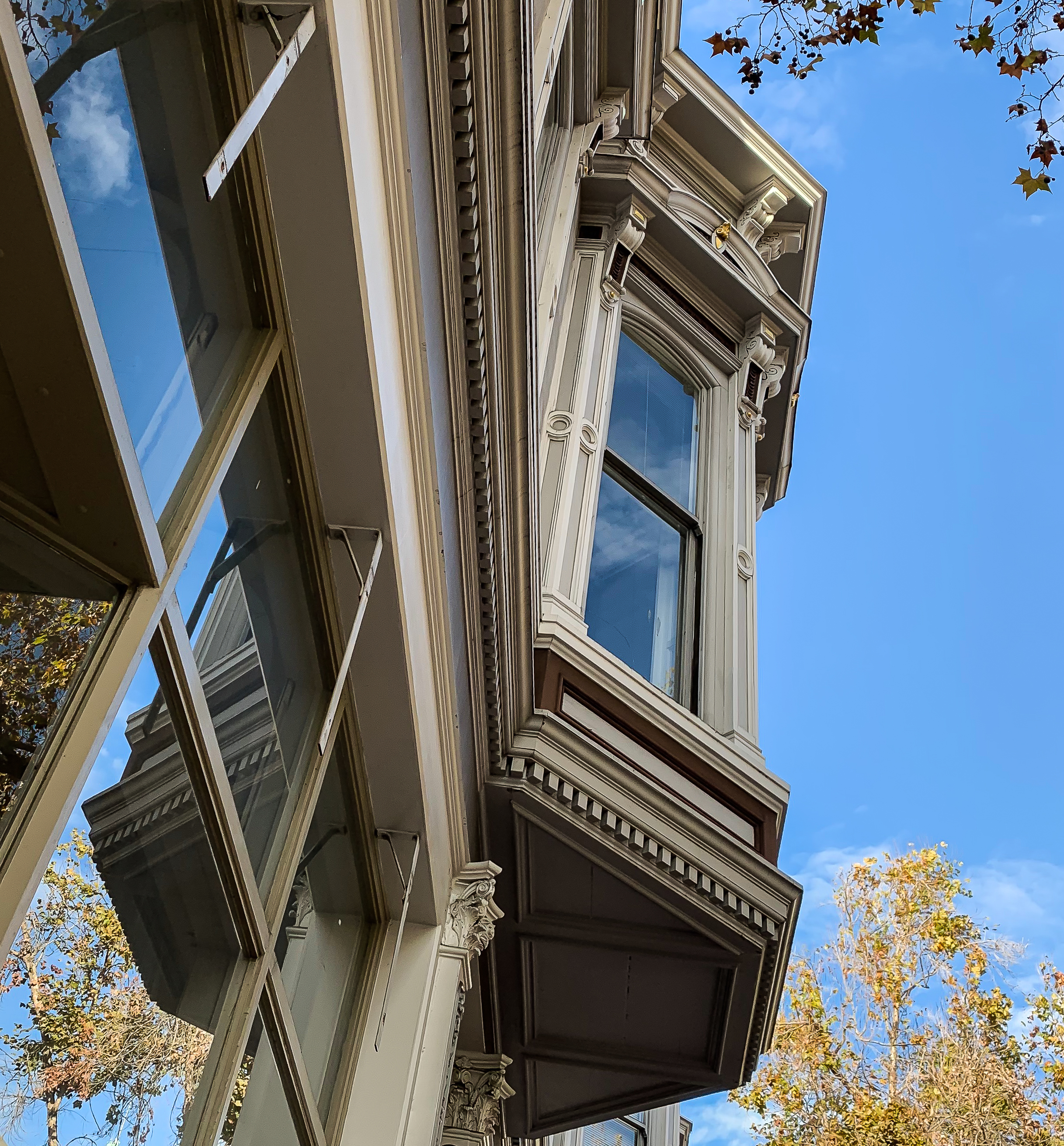 Windows and reflections of a clear sky