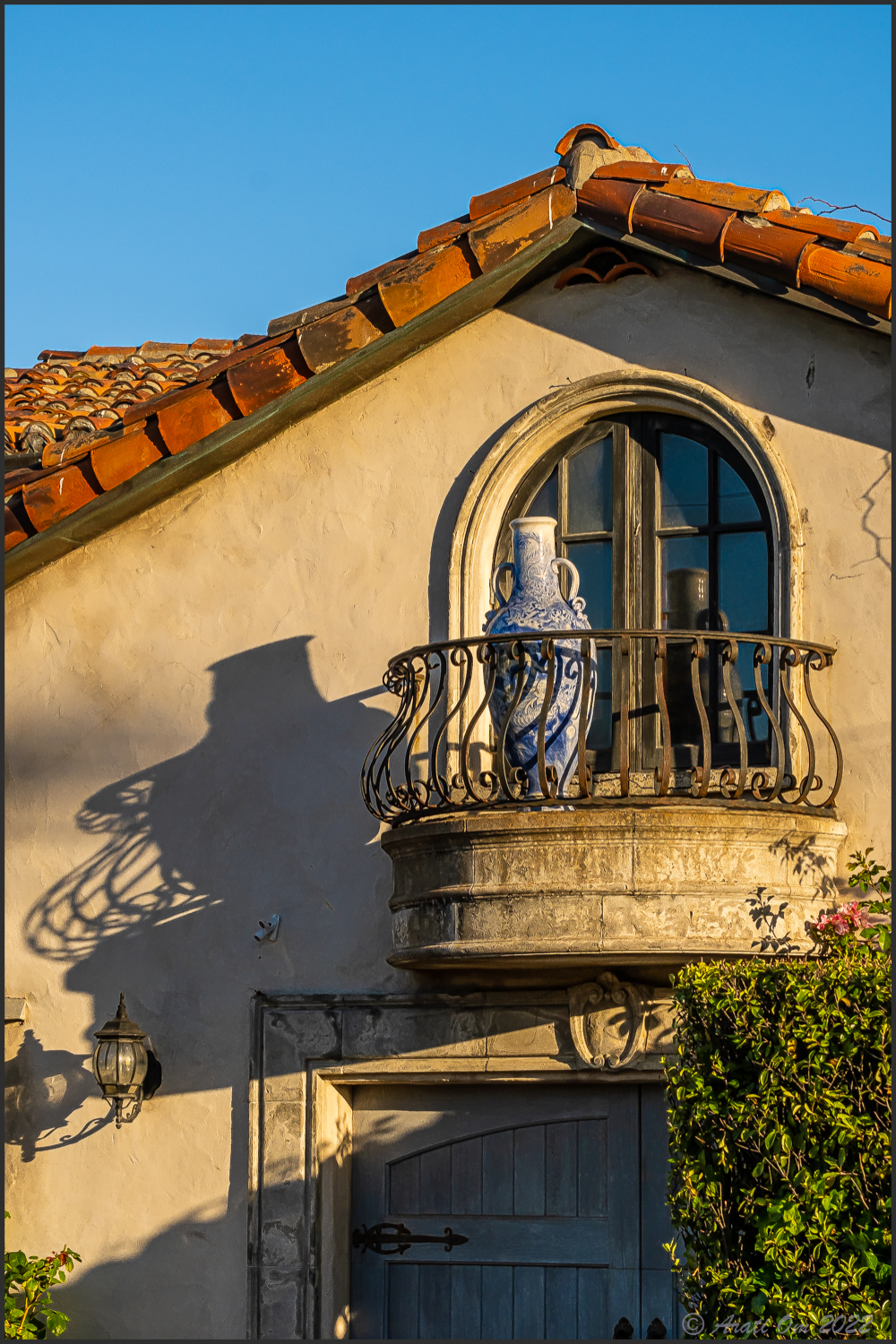 Vase on a balcony with a&nbsp;lamp