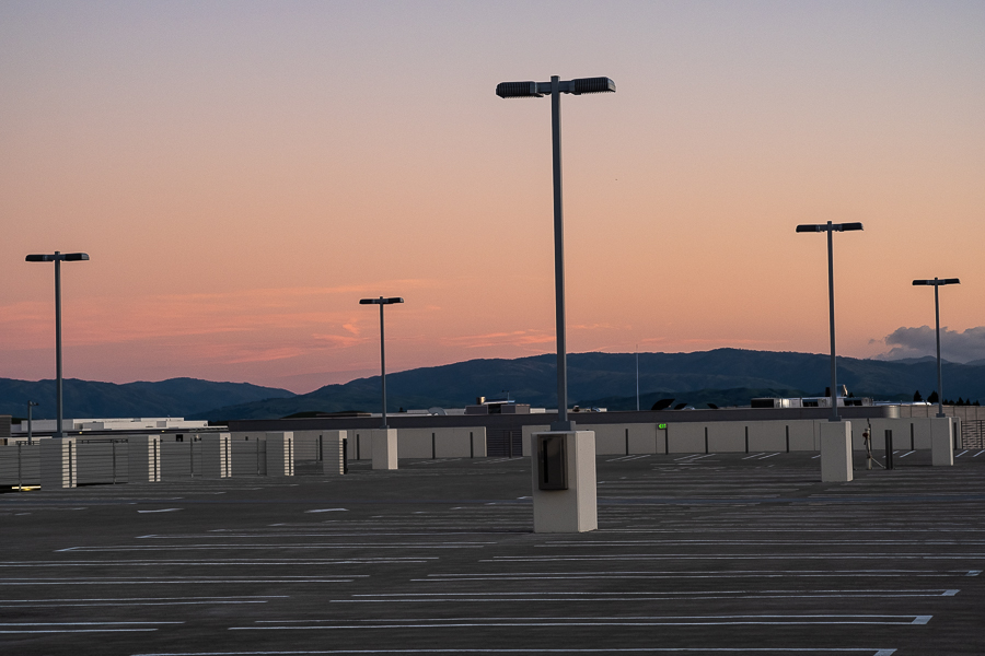 Line dancing in an empty parking lot at&nbsp;twilight