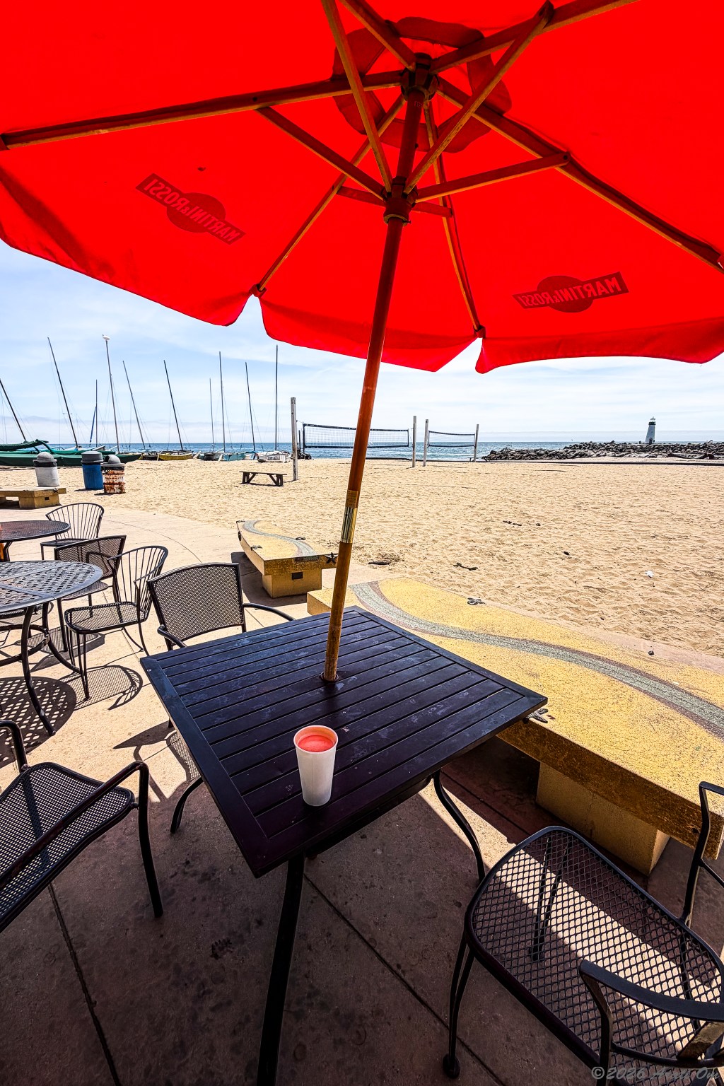 Sunlight a red parasol and a cafe&nbsp;latte