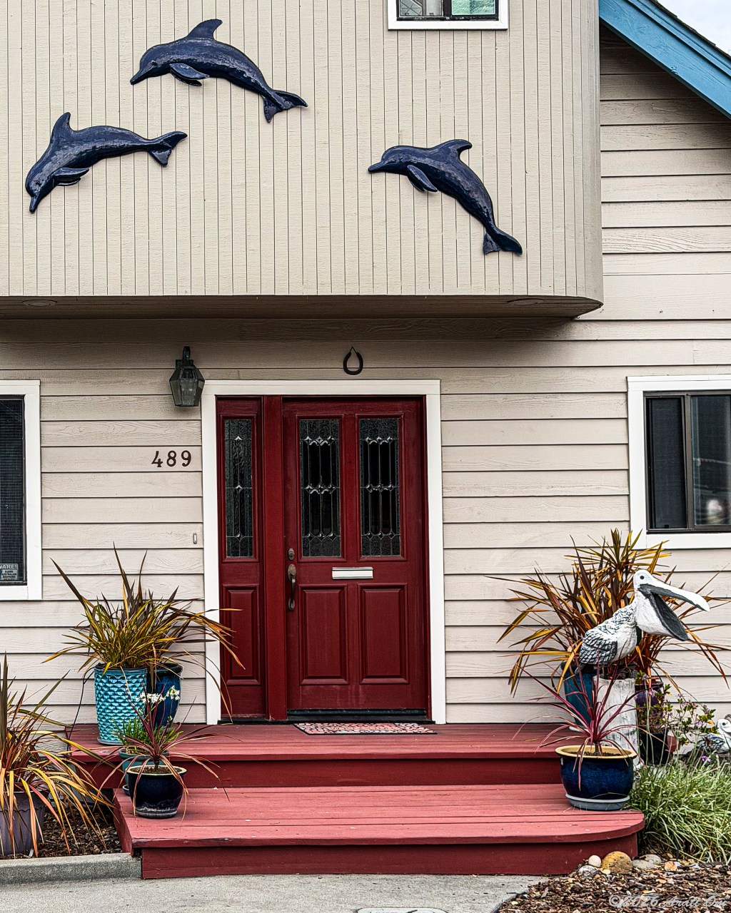 Thursday Doors: Three dolphins and a&nbsp;pelican